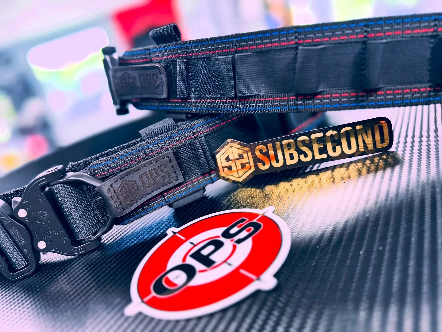 On Point x SubSecond custom belts with OPS patches
