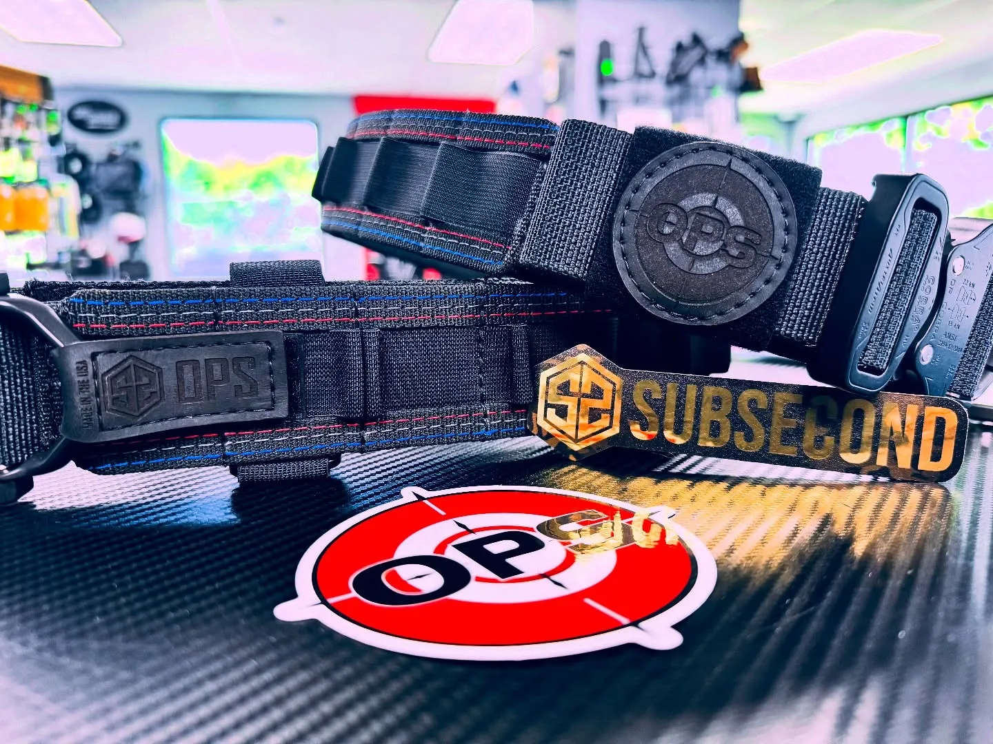 Custom On Point x SubSecond belts on the shop counter